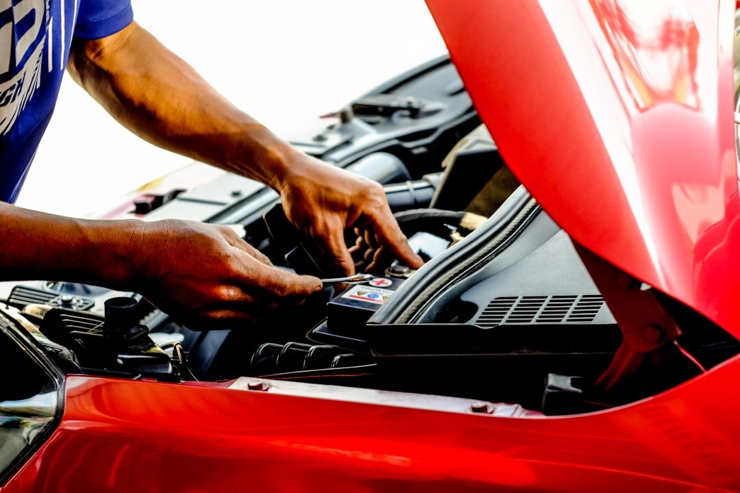 mechanic inspecting used car