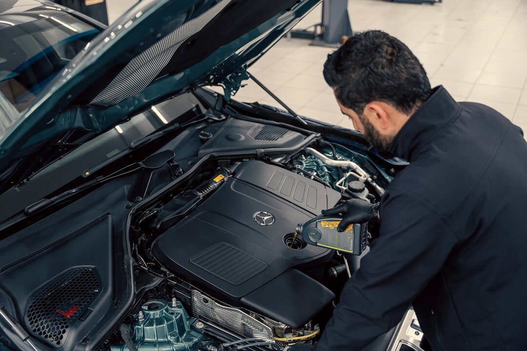 expert mechanic checking car engine