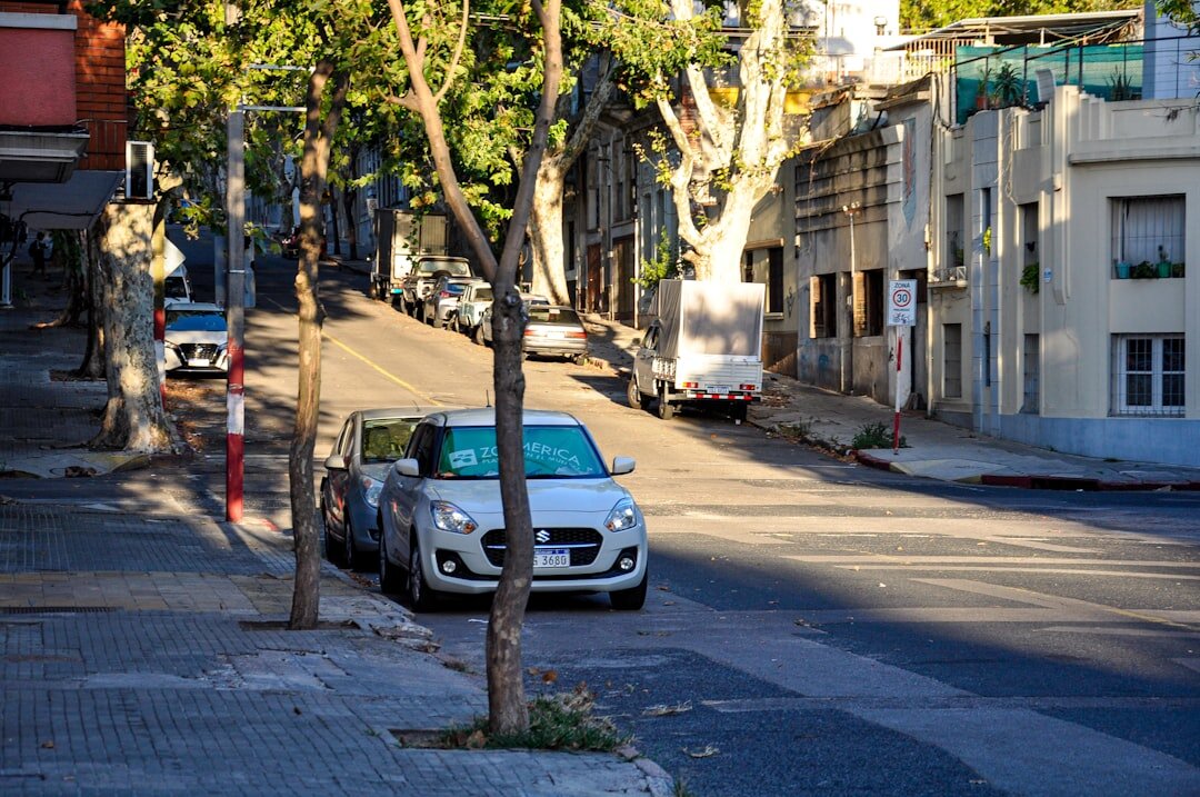Modern electric vehicle charging at a station in a Uruguayan city street